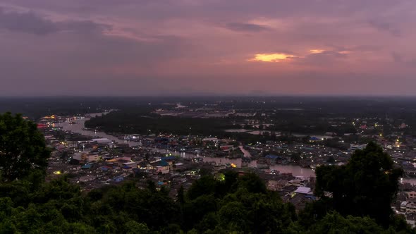 Pak Nam Chumphon town from Khao Matsee scenic viewpoint, day to night - Time Lapse