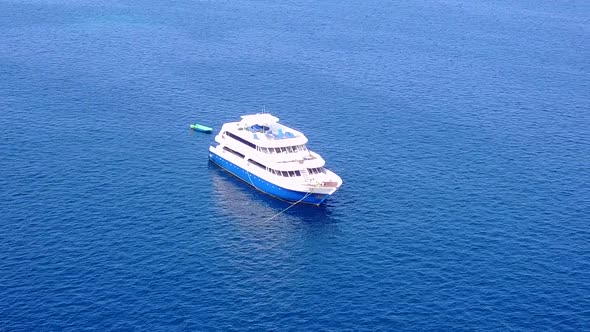 Daytime seascape of island beach by blue ocean with sand background near reef alt