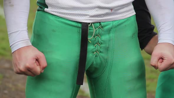 Masculine Power of Young Man in Sports Uniform Clenching Fists and Applauding alt