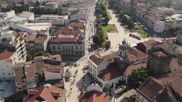 Aerial top-down circling over Braga old city center, Portugal alt