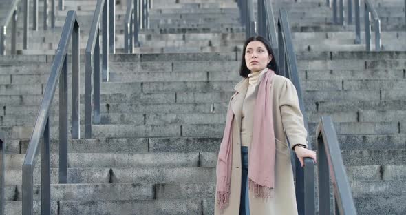 Portrait of Adult Brunette Caucasian Woman Looking at Her Watch As Waiting for Someone. Confident alt