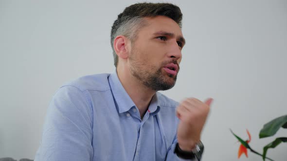 Close Up Angry Adult Man with Mental Health Talking to Doctor Psychotherapist alt