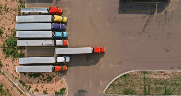 Aerial view of parking lot with trucks on transportation of truck rest area trailers logistics dock alt