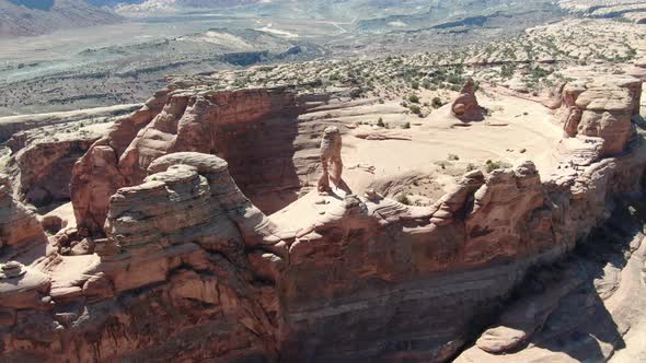 Grand Canyon with Lots of Tourists Walking on Top of a Huge Cliff Aerial Shot alt