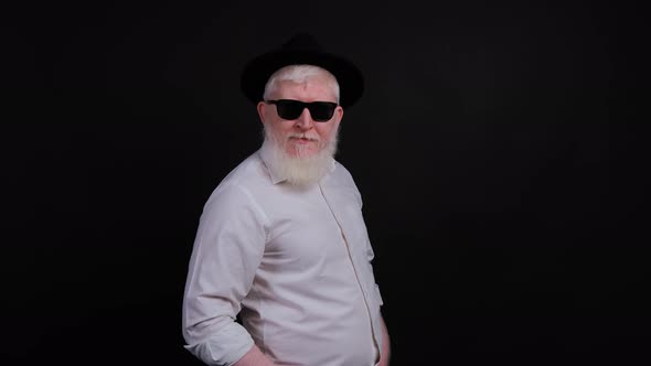 Portrait of Bearded Handsome Young Man with Albinism That Is Posing Over Black Background alt