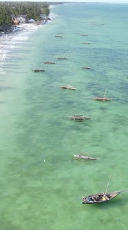 Boat Boats in the Ocean Near the Coast of Zanzibar Tanzania Slow Motion Vertical Video alt