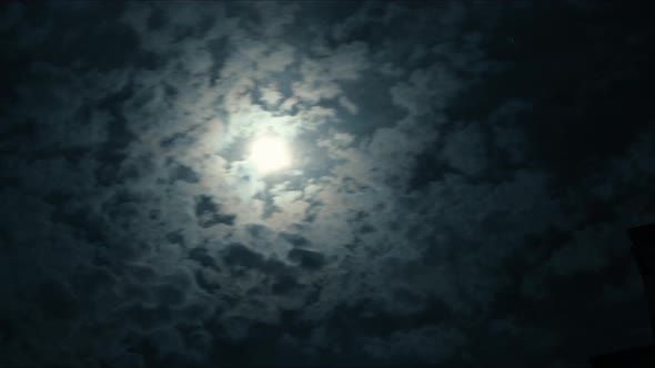 Time Lapse Night Clouds Running in Front of Spooky Full Moon alt