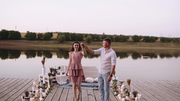 Front Frame, Couple in Love Walking on a Wooden Pond. Bridge Arranged with Decoration for Marriage alt
