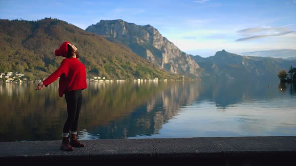 Beautiful Calm Woman Sitting on Rock Coastline alt