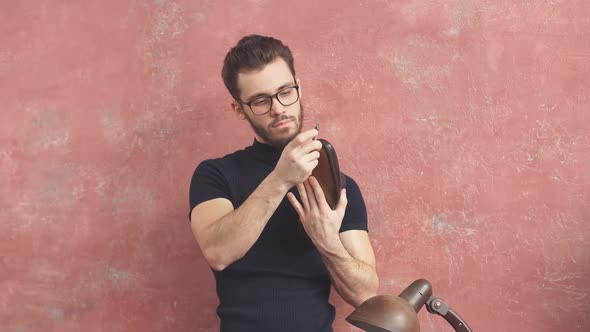 Young Man Checking the Glued Sole alt