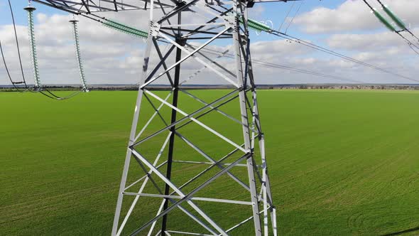 Motion Up Along Tower of Power Transmission Lines in Field