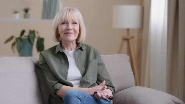 Portrait at Home Pensive Thinking Smiling Beautiful Older Adult Caucasian Lady Looking Away at alt