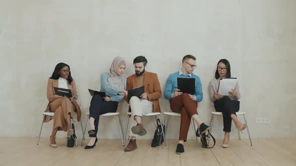Diverse Group of People Waiting for Job Interview alt
