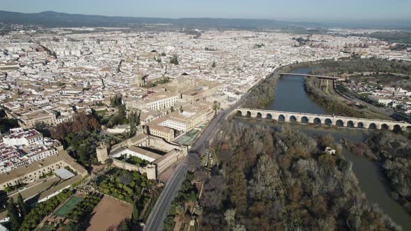Aerial drone pov of Cordoba city in Spain and Guadalquivir river