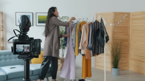 Fashion Blogger Recording Video About Clothing Then Showing Thumbsup and Turning Off Camera alt