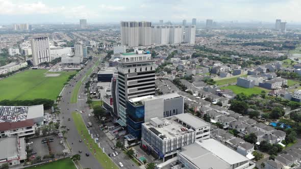 Aerial view of a small city with green areas