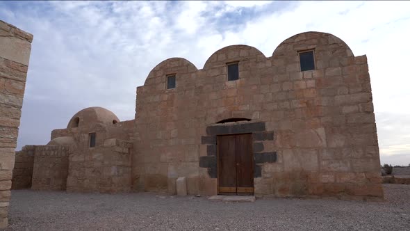 Qasr Amra Desert Castle With Three Domes On A Cloudy Day alt