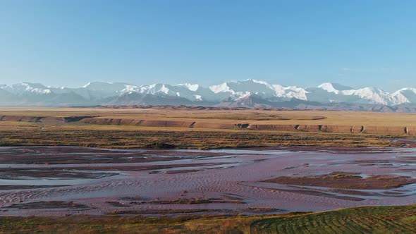Aerial View of Multicolored and Variegated Landscape During Sunset alt
