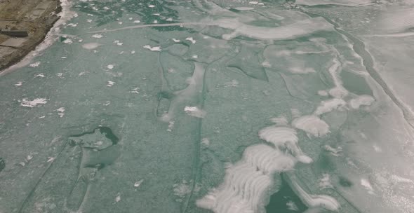 Cinematic aerial shot of frozen Attabad Lake , Hunza , Northern area of Pakistan. alt