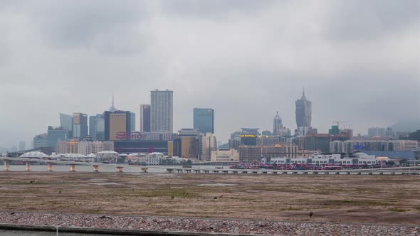 Macau Peninsula of China with Cathedral Silhouette Timelapse alt