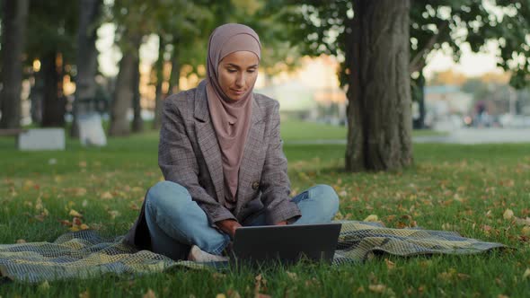 Muslim Arab Islamic Student Girl in Hijab Business Woman Freelancer User Uses Laptop Sitting on alt