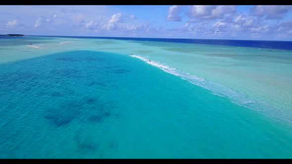 Aerial travel of idyllic coastline beach trip by blue ocean with white sand background of a dayout b alt