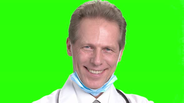 Mature Smiling Doctor's Face. alt