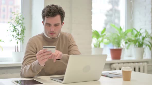 Man Making Successful Online Payment on Laptop alt