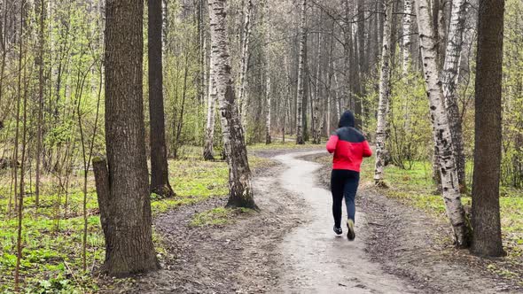 The Young Men is Running He Dressed in Red Rain Jacket and Snickers Outdoors Sports the Panoramic alt