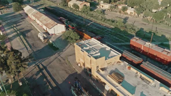 Aerial Of A Freight Train Passing Through Mexican northern Countryside alt