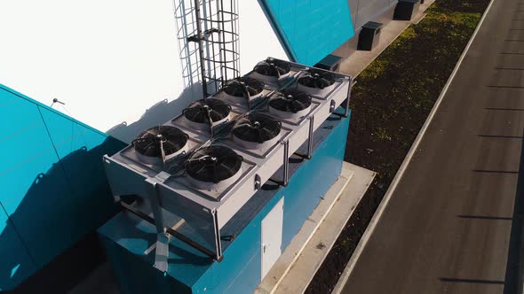 Set of Powerful Air Conditioners on Roof of Warehouse alt