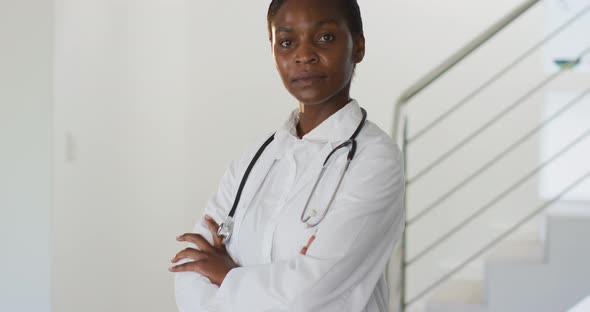 Portrait of african american female doctor looking to camera smiling alt