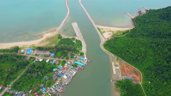 Aerial Shot of Local Fisherman Village Beside the sea. alt