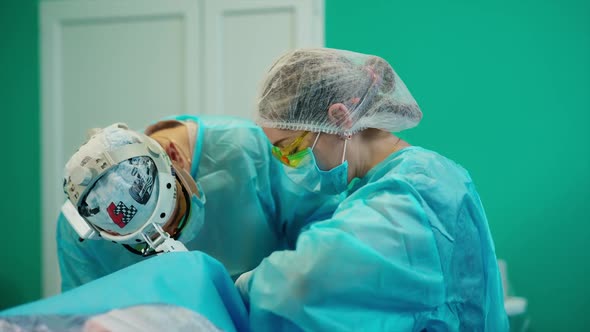 Doctors during surgery. Team operating patient in operation theater alt
