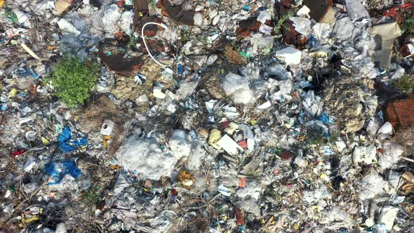 Aerial Top Flying Over Toxic Plastic Garbage And Household Waste In A Landfill alt