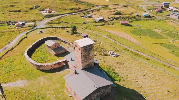 Cinematic Aerial View Of Old Monastery Building In Ushguli alt
