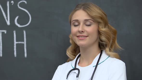 Confident Female Doctor Standing Near Men Health Phrase, Disease Prevention alt