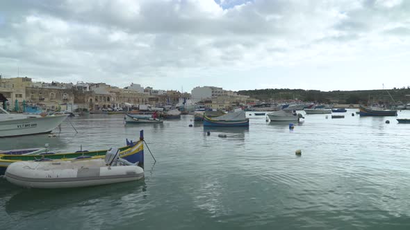 Traditional Fishing Boats Decorated with Osiris Eyes in the Harbour of Marsaxlokk alt