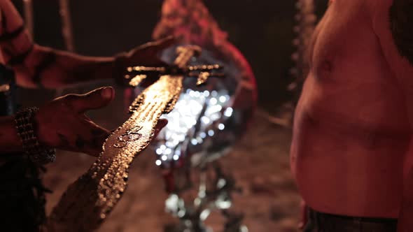 Evil Aggressive Viking Warrior in Northern Tattoos Bare Torso with a European alt