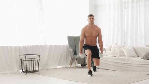 Athletic Man with Naked Torso Is Doing Lunge Squat Exercise at Home, Front View
