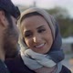 Cute Woman in Hijab Looking at Boyfriend While Dating Outdoor - VideoHive Item for Sale