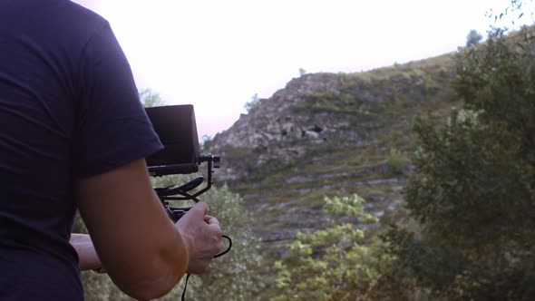 The Operator Films the Cave Dug in the Rock alt