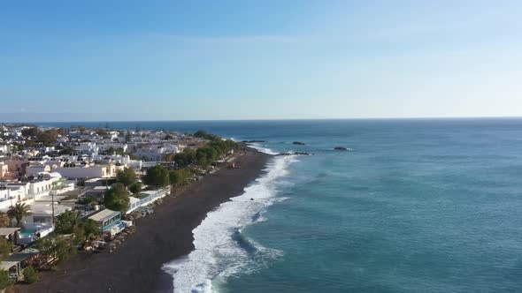 Aerial view of Kamari beach on Santorini island alt