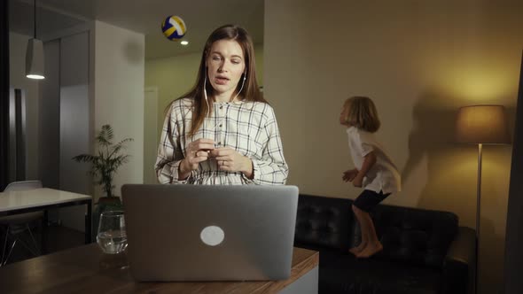 Business Woman Working with Kid Together From Home, Having a Video Call with Colleagues