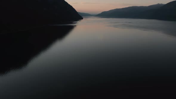 Lake Teletskoye between mountains in sunset in Altai alt