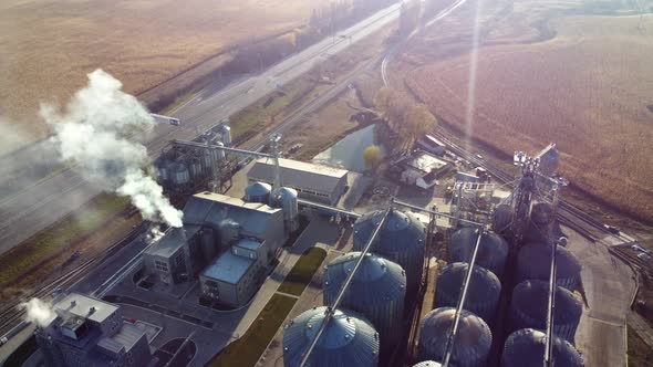 Aerial Drone View Flight Over Complex of Grain Elevator Buildings alt
