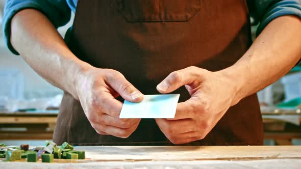 Young master breaking glass with his hands alt