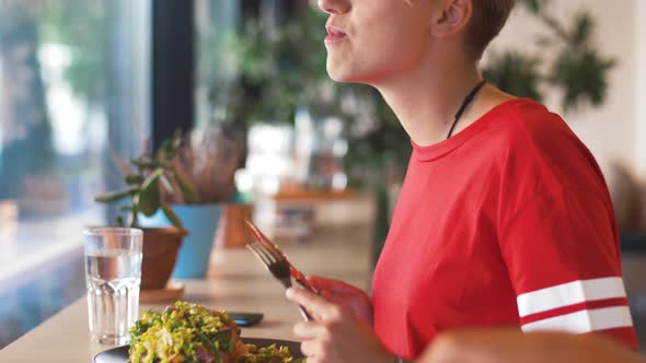 Female Friends Eating at Restaurant  alt