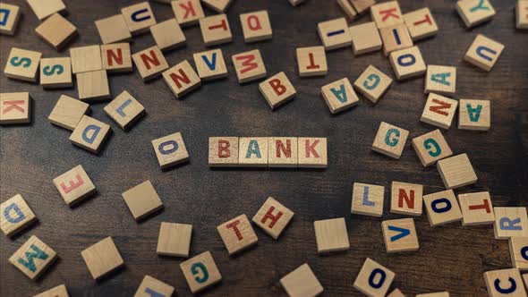 A Word BANK Made of Wooden Letters Vocabulary Game Savings and Budget Concept alt