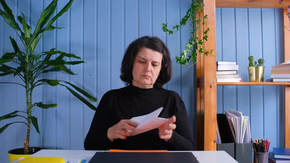 Emotional Middle Aged Woman Reading Paper Letter Good News